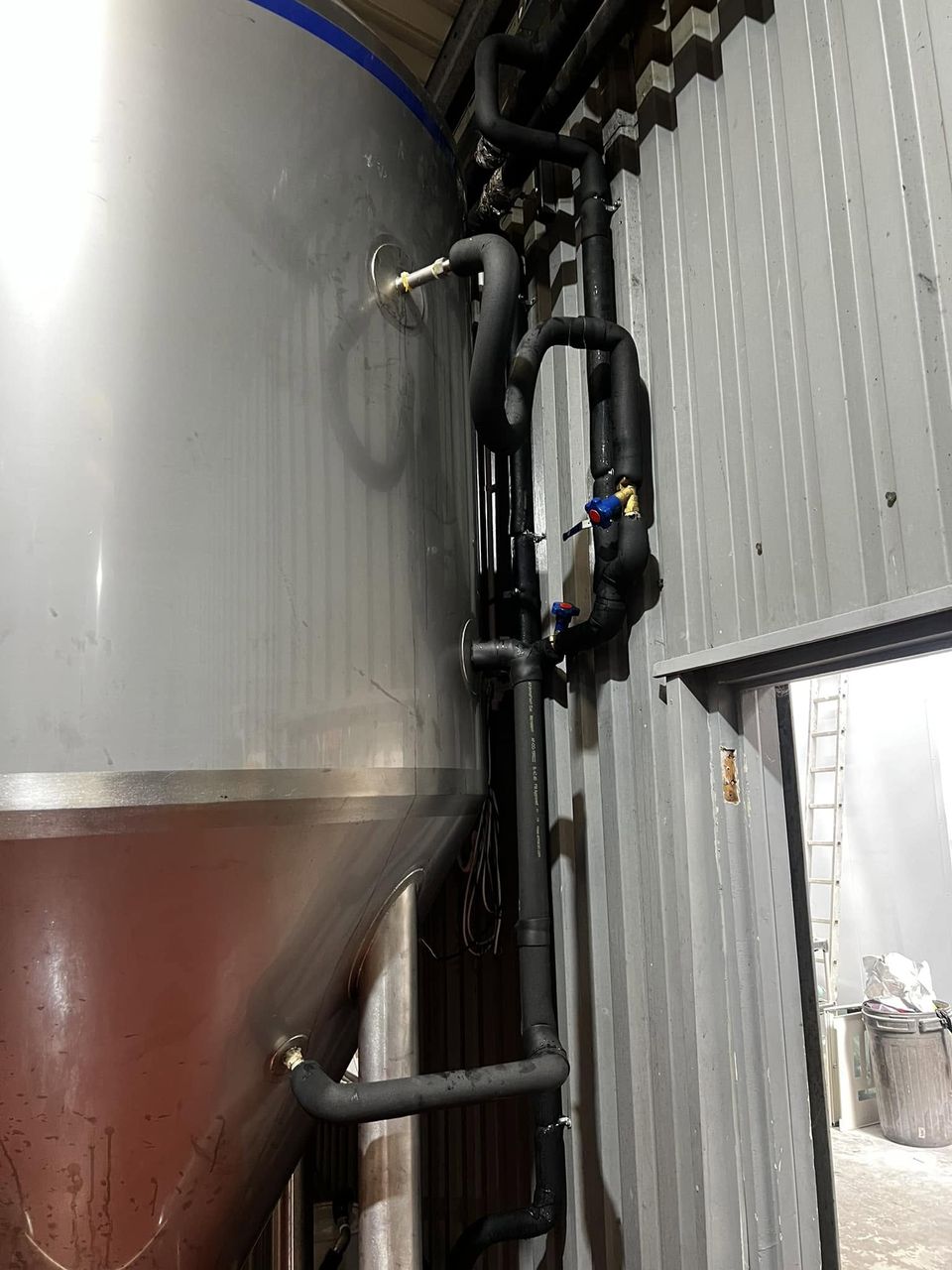 Stainless steel beer tank piped into a chilled glycol system