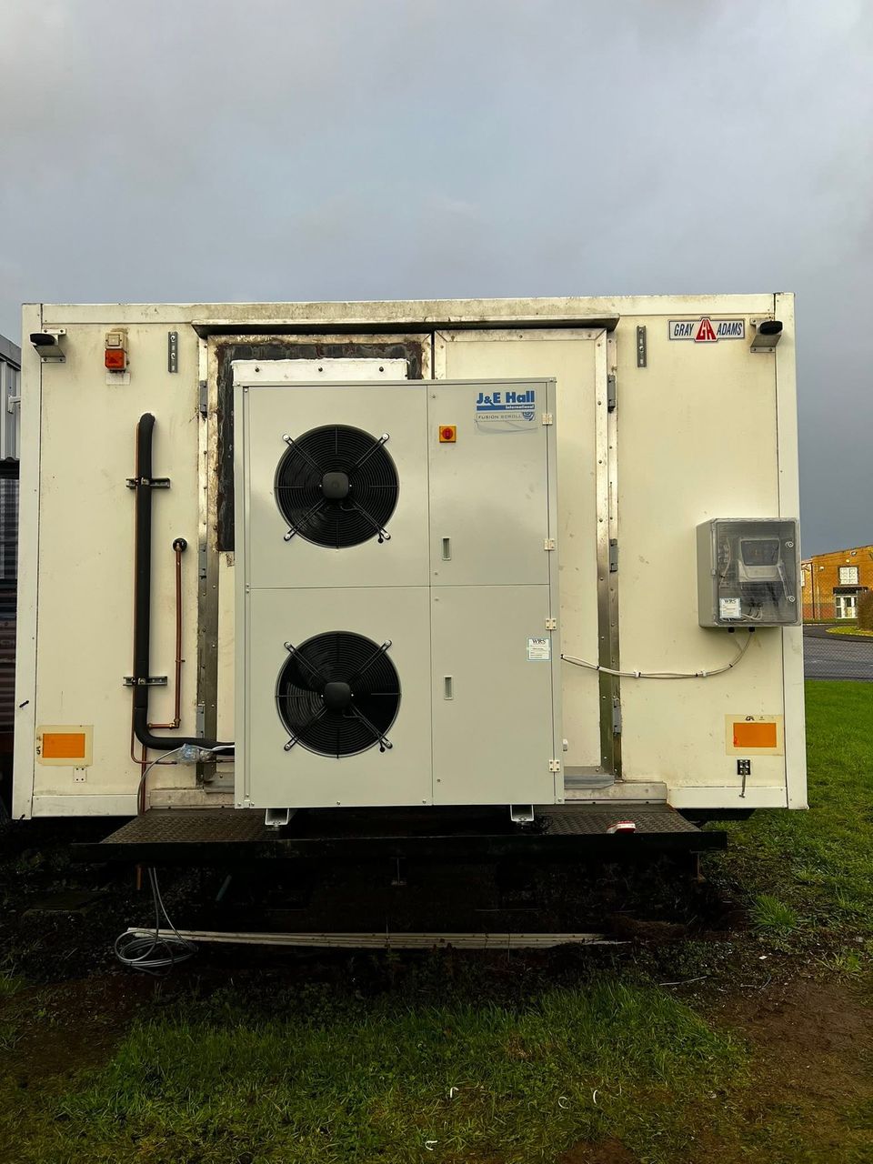 J&E Hall condensing unit on an outdoor plant platform