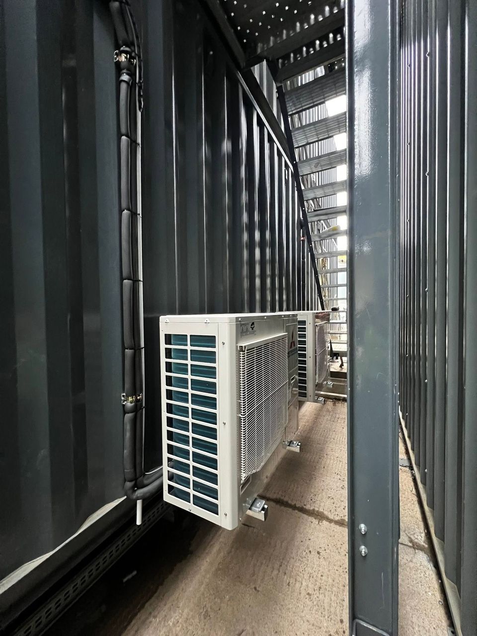 Outdoor condensing unit mounted beside the control room