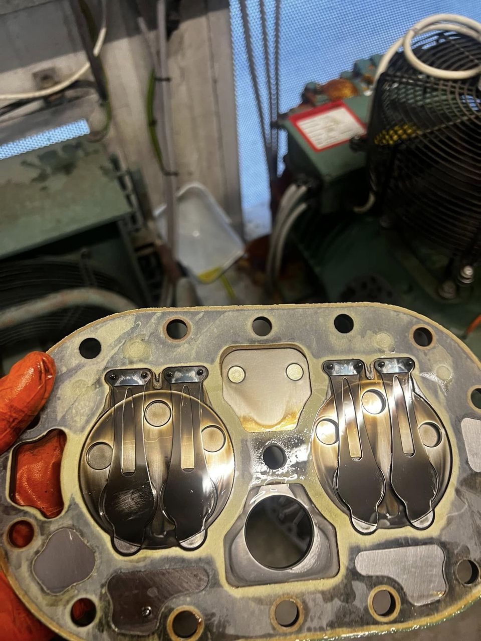 Compressor valve plate during inspection